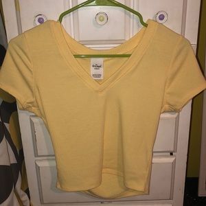 yellow v-neck shirt